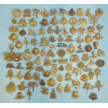 A collection of one hundred various military badges, (100).