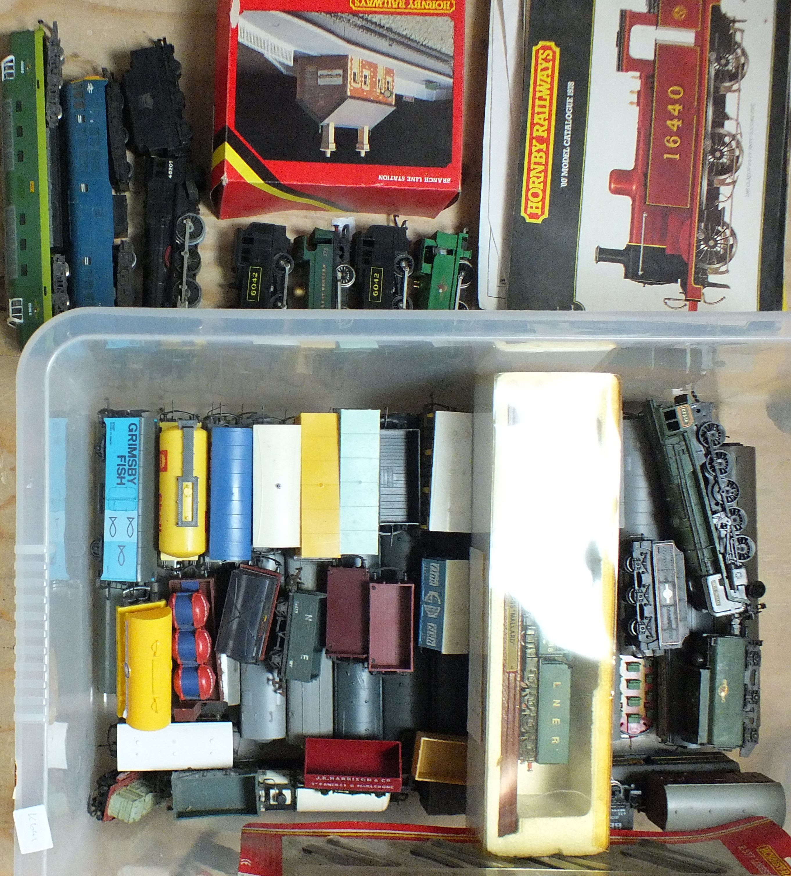 A quantity of unboxed OO gauge, locomotives, coaches and wagons, Hornby catalogues, etc, by