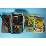 A quantity of red and green Meccano, with instructions for Outfit No.5, a Meccano magazine and