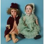 A Handwerk bisque head doll with sleeping brown eyes and mohair wig, on jointed composition body,