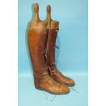 A pair of Edwardian tan leather riding boots, part-laced, part-strap, approximate size 10,