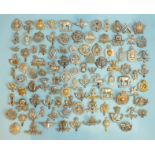 A collection of one hundred various military badges, (100).