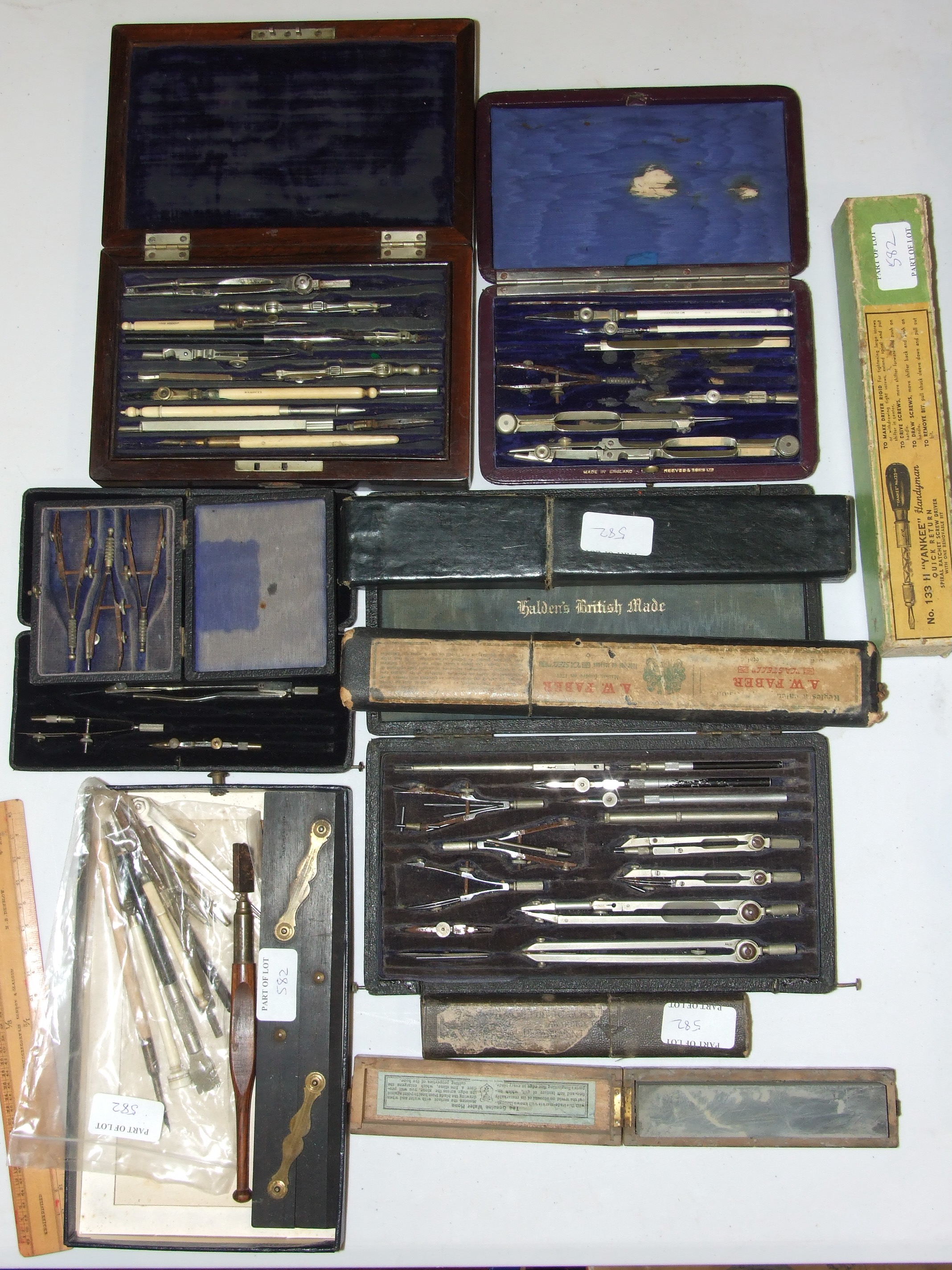 A collection of drawing instruments in rosewood box, various makers and a collection of slide