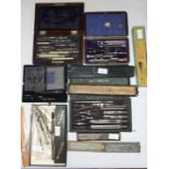 A collection of drawing instruments in rosewood box, various makers and a collection of slide