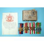 A WWII group of four medals: War Medal 1939-45, Africa and Italy Stars, with leaflet and box of