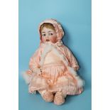 A Kammer & Reinhardt, Simon & Halbig bisque head baby doll with flirty brown eyes, moving tongue,