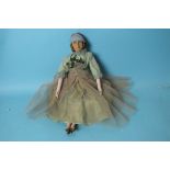An early-20th century Lenci-style fabric-headed boudoir doll with painted features and long