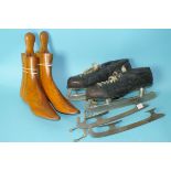 A pair of wooden shoe lasts and a pair of Canadian ice skates with spare blades, boxed.