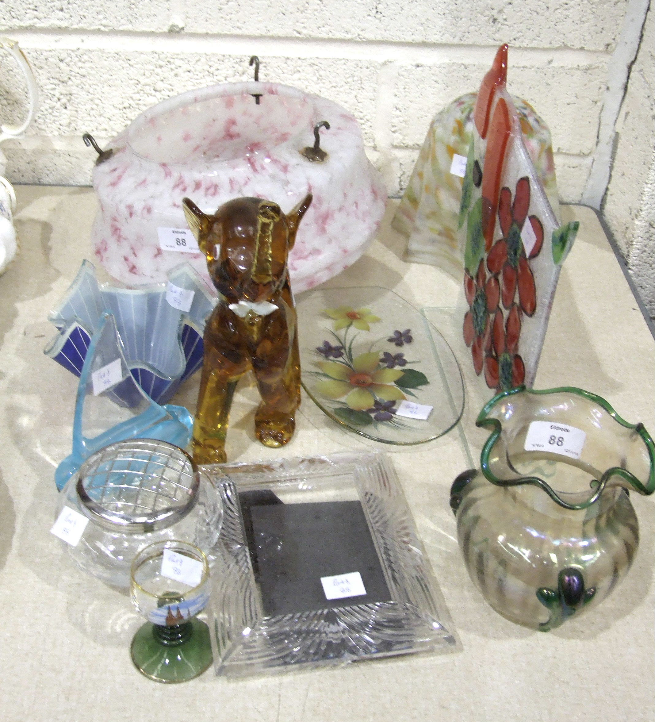 A Loetz-style green and iridescent glass vase, two 1930's lamp shades and other items.