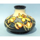 A Moorcroft Pottery Limited-Edition vase of squat baluster form decorated with yellow flowers by