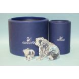 A Swarovski Crystal Grizzly Bear and bear cub, both boxed, (2).