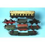 A quantity of Hornby O Gauge tinplate locomotives and coaches and a Märklin coach and guard's van.