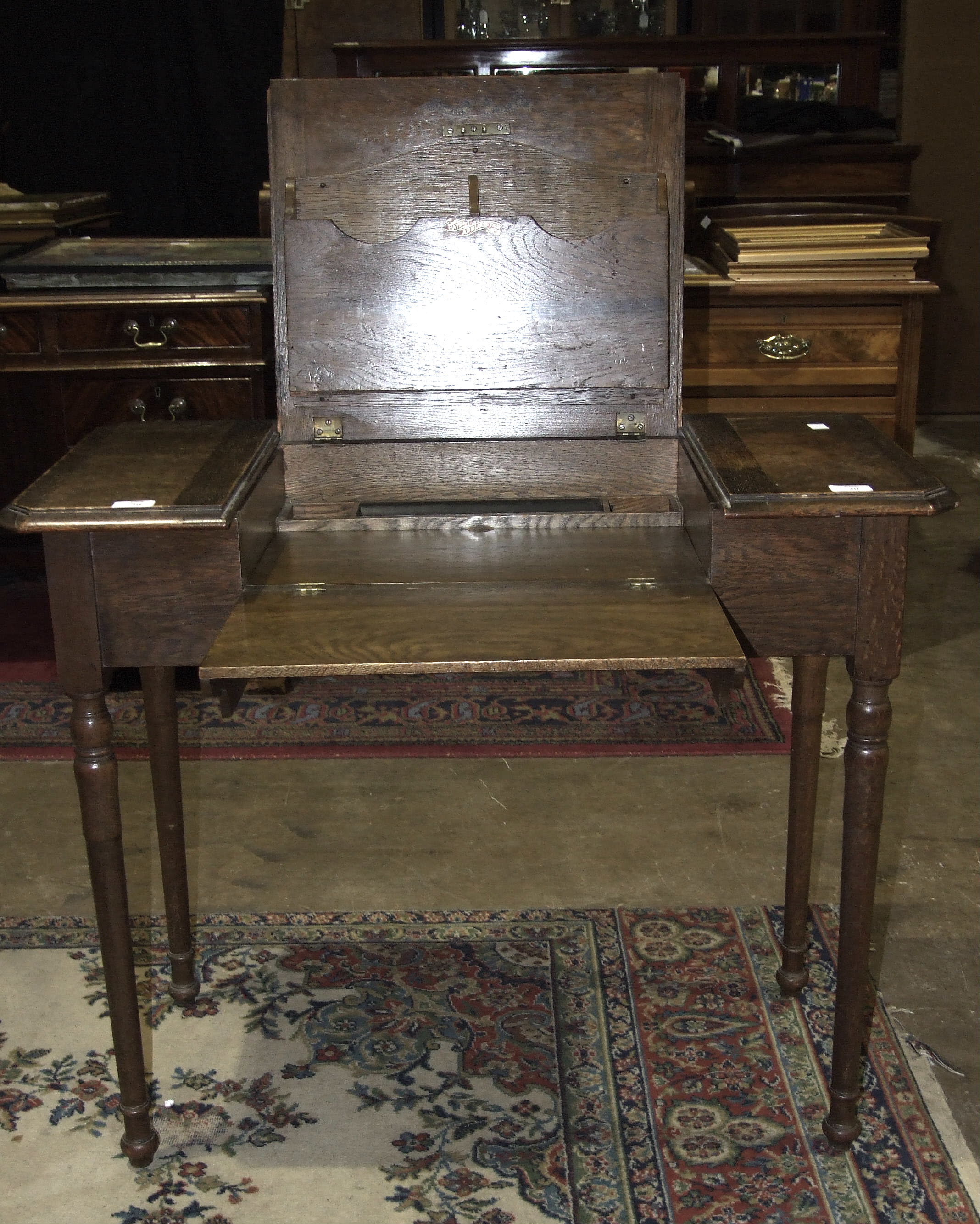 'The Britisher Desk', an early-20th century folding writing desk fitted with stationery