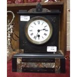 A black and coloured marble mantel timepiece with white enamel dial, 29cm high.