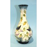 A Moorcroft Pottery bottleneck vase decorated in the 'Sweet Thief' pattern, impressed and painted