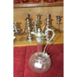 A pair of modern silver-plated short candelabra, 26cm high, 30cm wide and an etched glass wine jug