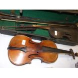 A late-19th/early-20th century full-size violin with 'Guarnerius' paper label, another label '