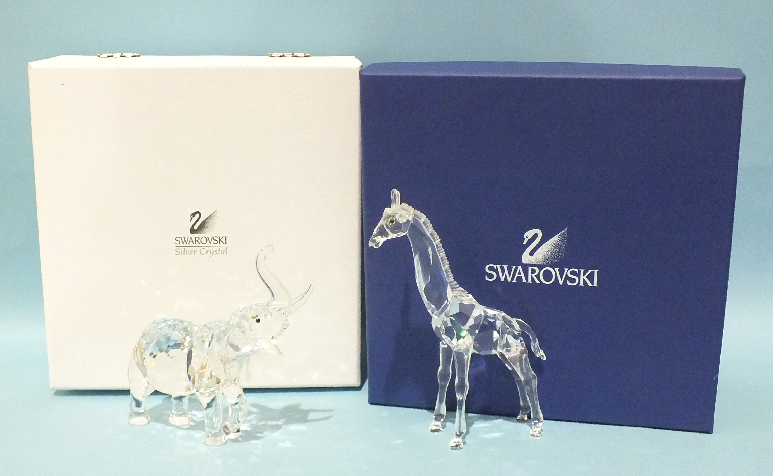 Two Swarovski Crystal figures: Elephant Mother and Standing Giraffe, both boxed, (2).