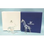 Two Swarovski Crystal figures: Elephant Mother and Standing Giraffe, both boxed, (2).