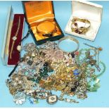 A quantity of costume jewellery and wrist watches, including a gold-plated bracelet set tiger's eye,