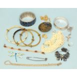 A silver hinged bangle (a/f), three horn bangles and a small quantity of costume and silver