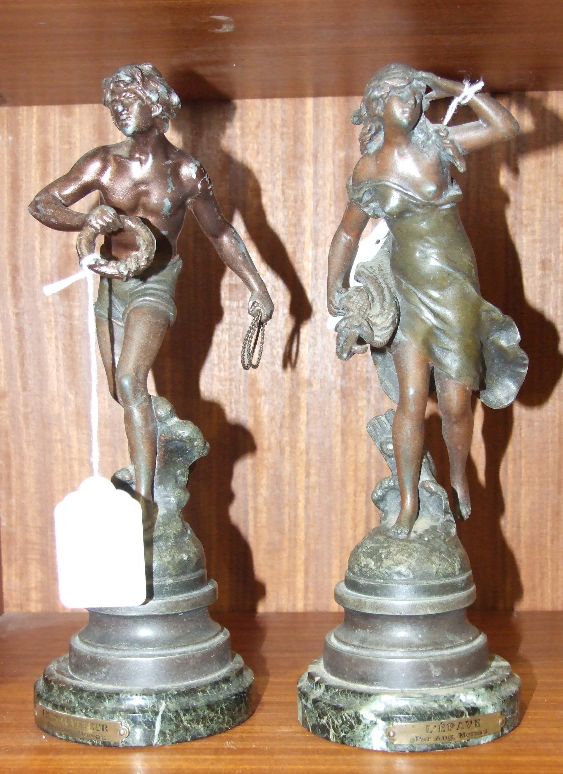 A pair of spelter figures after Augustus Moreau, 'L'Épave' and 'Le Sauveteur', 25cm high, (2).