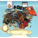 A quantity of beads and costume jewellery.