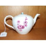 A late-Meissen bullet shape teapot decorated with puce sprays of flowers, cross swords mark beneath,