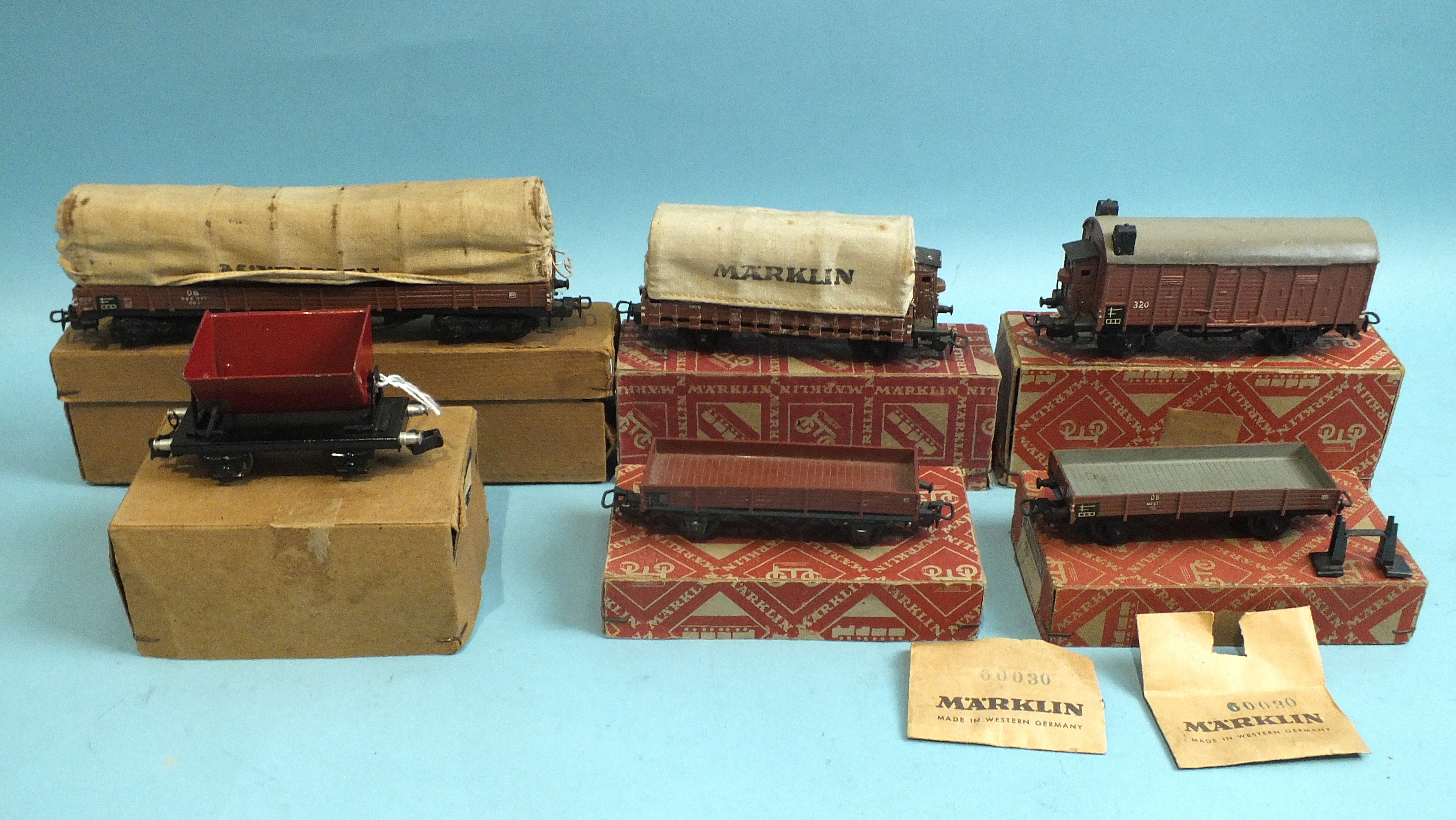 Märklin HO gauge, 393C covered wagon, in original brown box, four other wagons in orange bicycle