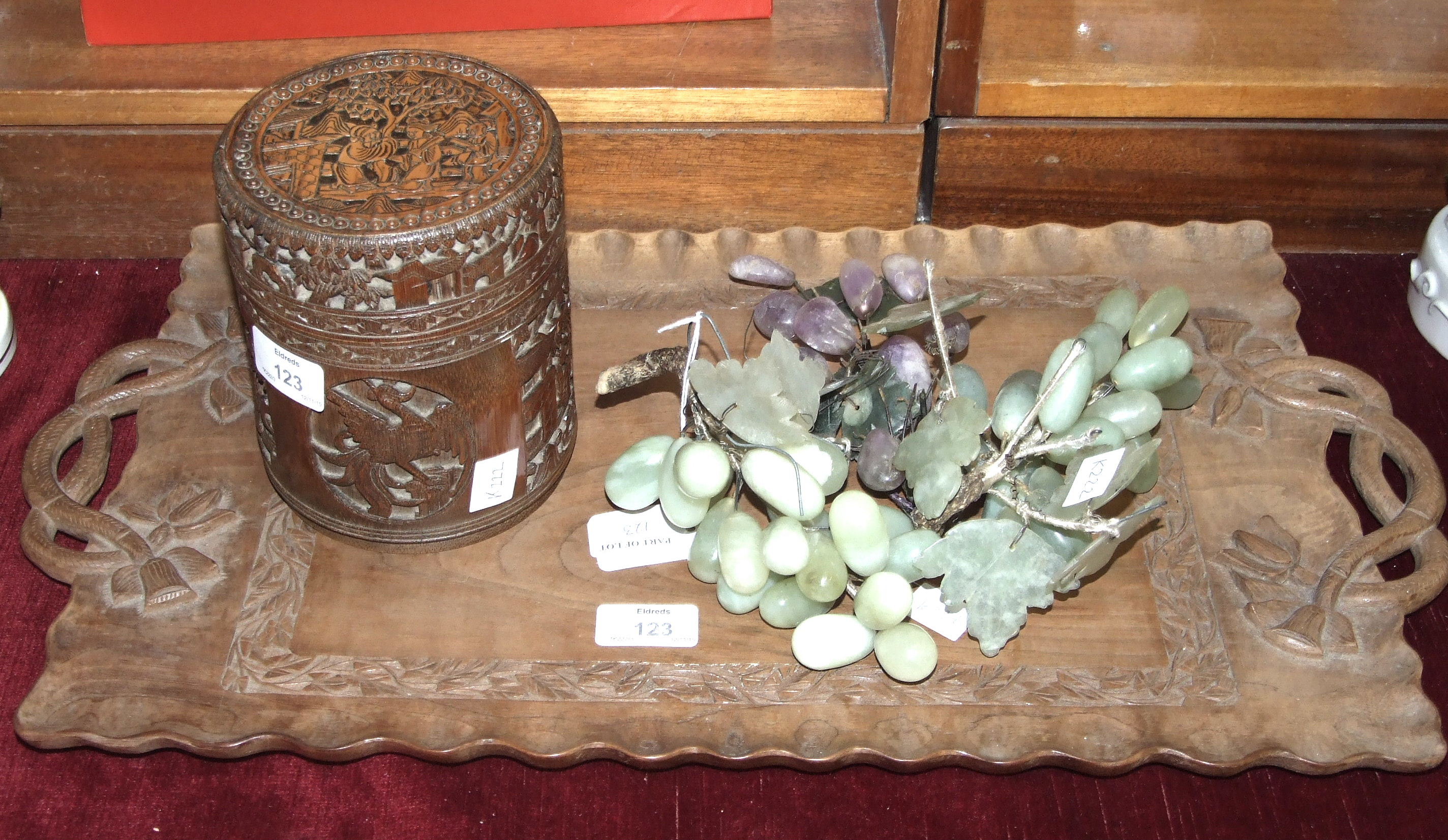 A carved bamboo brush pot, 17cm high, a carved wood tray and other items.