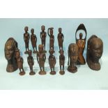 A pair of African carved hardwood bookends in the form of heads, 22cm high, a group of ten carved