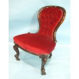 A Victorian mahogany spoon-back salon chair, the upholstered back with carved front legs.