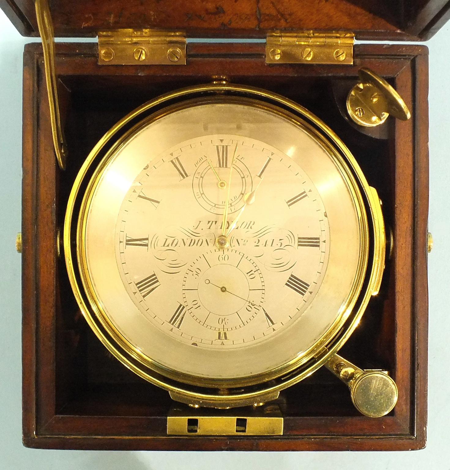 A marine chronometer, the four-inch silvered dial signed J Taylor, London, No.2415, with