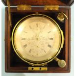 A marine chronometer, the four-inch silvered dial signed J Taylor, London, No.2415, with