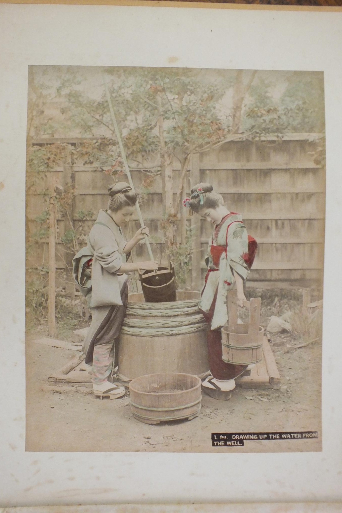 An early-20th century Japanese lacquered shibayama photograph album, containing fifty hand-tinted - Image 14 of 54