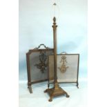 A bronzed metal Corinthian column standard lamp raised on stepped square plinth with claw and ball