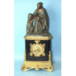 A 19th century bronze, gilt metal and black marble mantel clock of architectural form surmounted