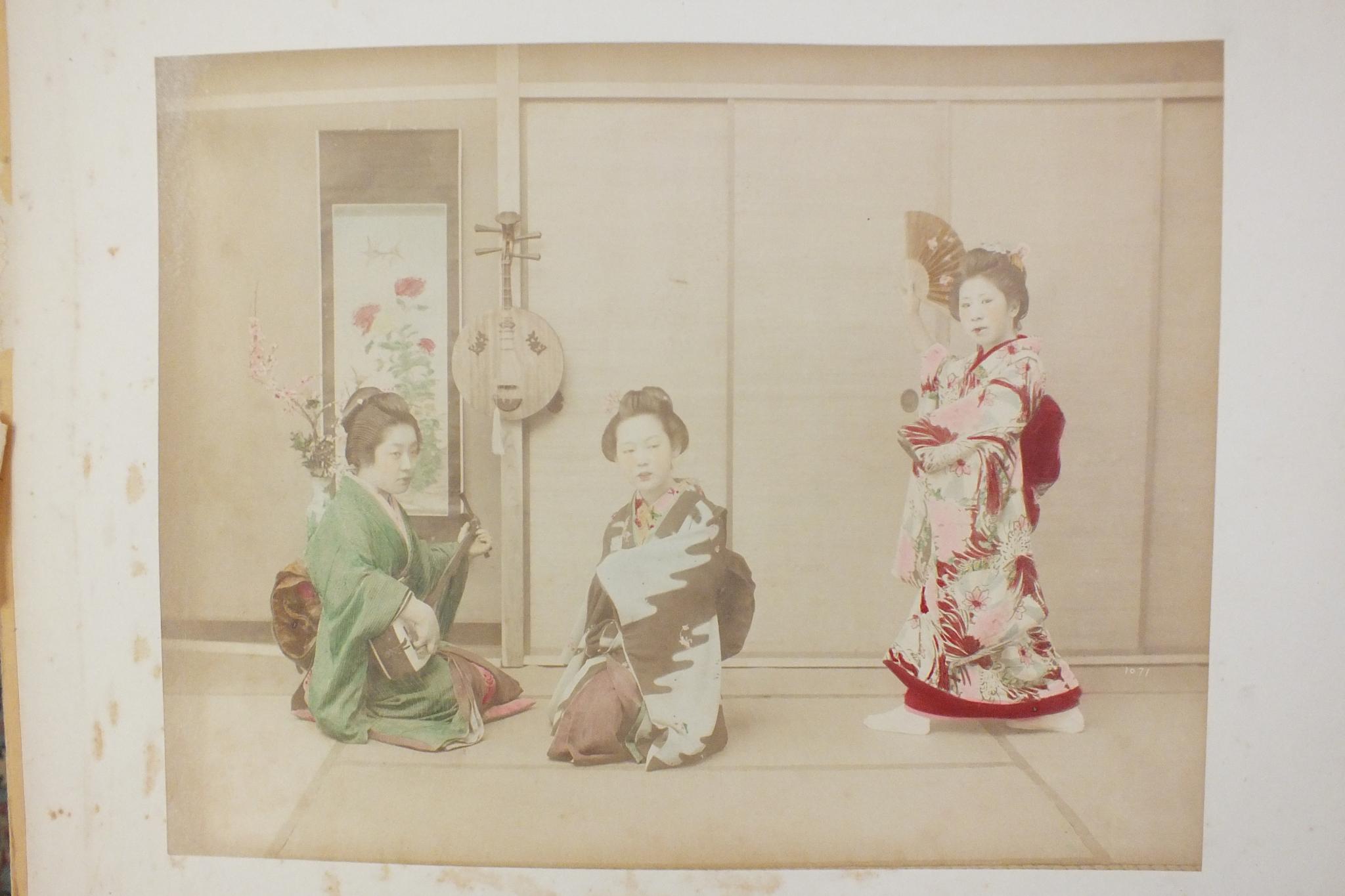 An early-20th century Japanese lacquered shibayama photograph album, containing fifty hand-tinted - Image 42 of 54