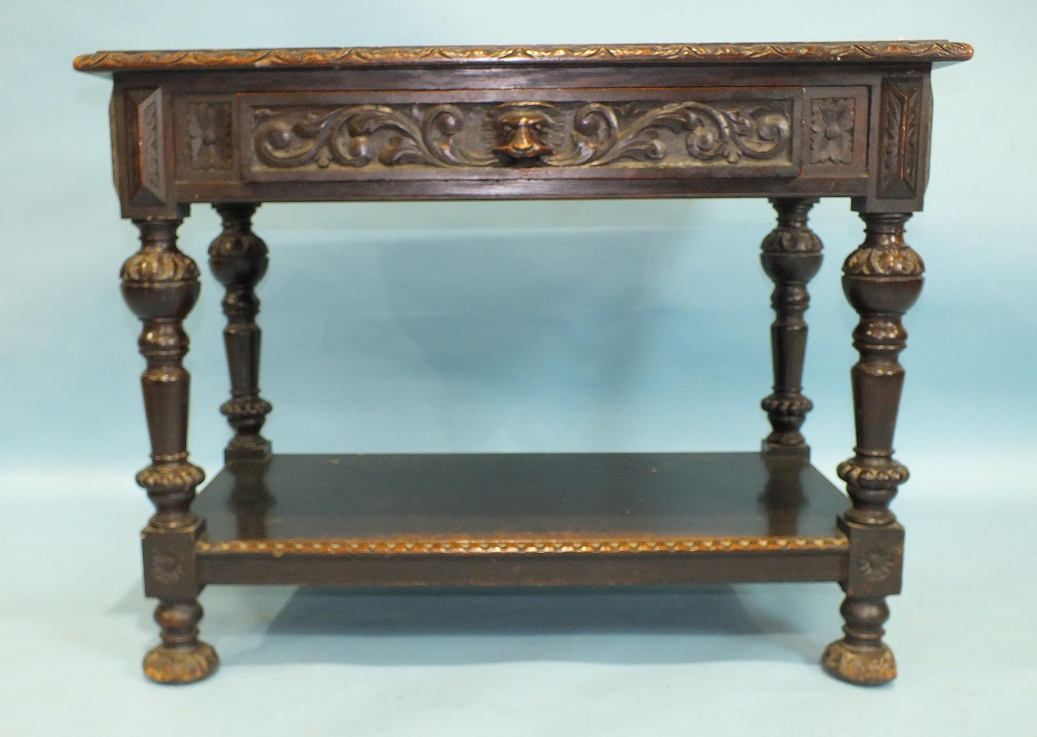 A 19th century carved oak serving table fitted with a frieze drawer, the legs joined by an