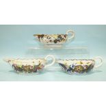 A pair of 18th century Chinese porcelain sauce boats decorated with a pseudo tobacco leaf design and