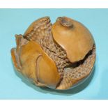 An Oriental carved model of a split pomegranate, 8cm diameter.