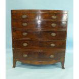 A 19th century mahogany bow-front chest of two short and four long cockbeaded drawers, on splayed