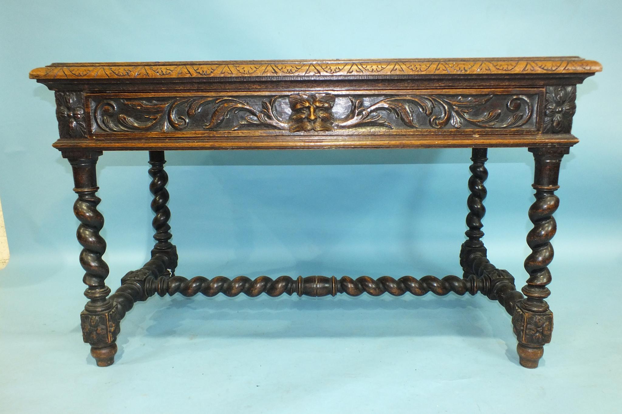 A Victorian carved oak rectangular centre table fitted with one frieze drawer, on spiral-twist