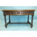 A Victorian carved oak rectangular centre table fitted with one frieze drawer, on spiral-twist