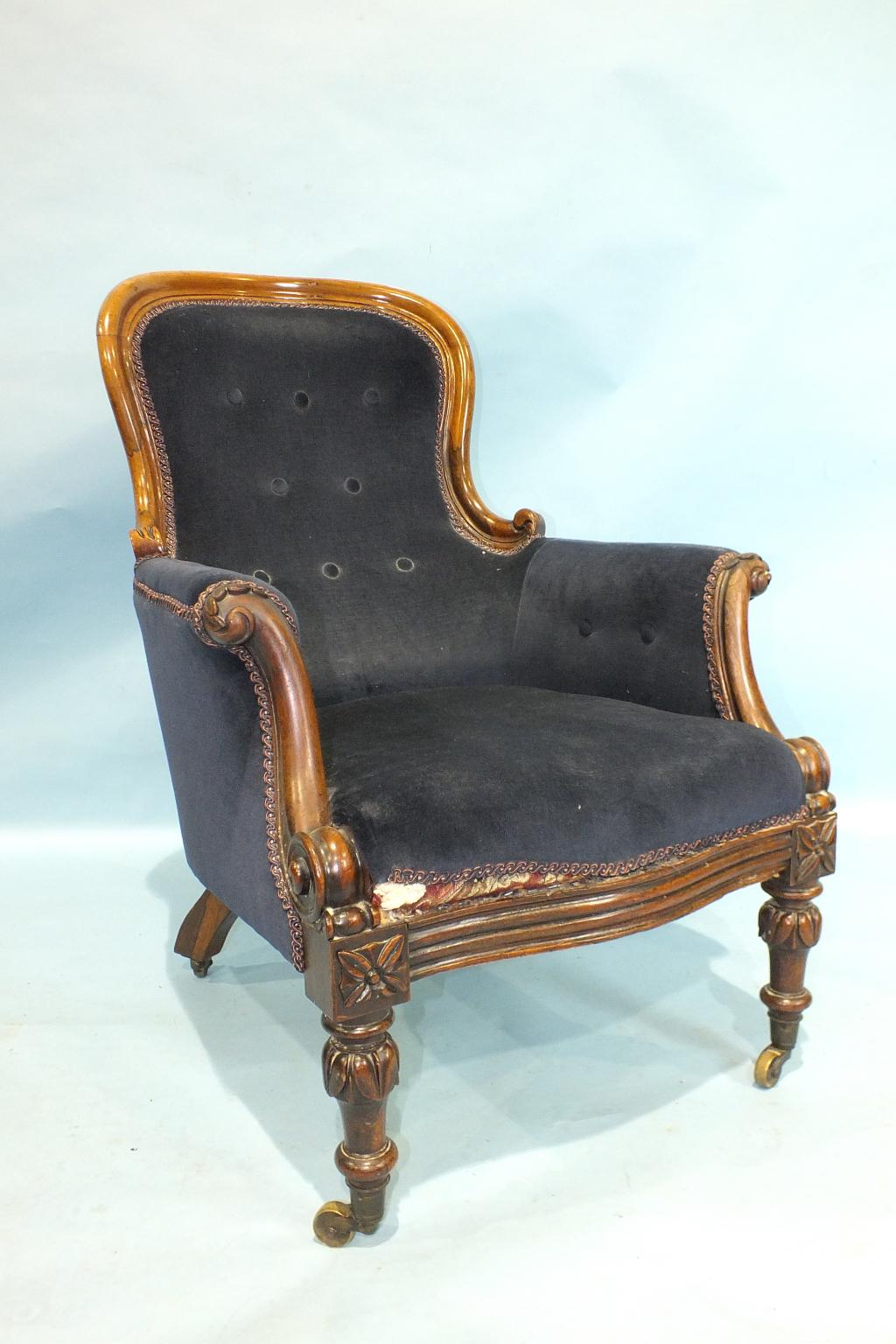 An early-Victorian rosewood salon chair, the carved frame with button back and upholstered