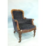 An early-Victorian rosewood salon chair, the carved frame with button back and upholstered