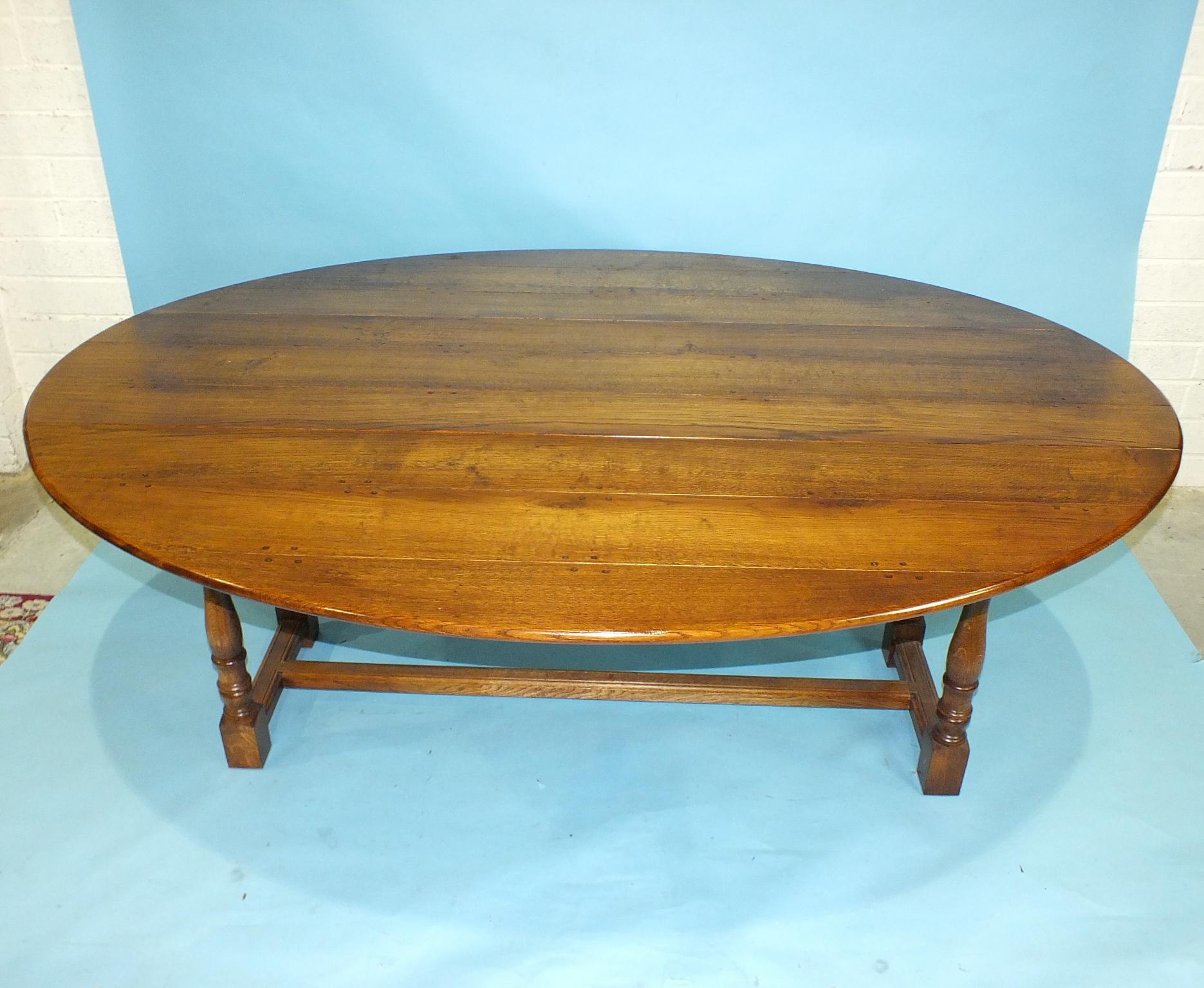 A reproduction elm wake table by Brights of Nettlebed, on turned legs joined by centre stretcher, - Image 2 of 2