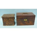 An early-19th century mahogany rectangular two-division tea caddy, the hinged lid revealing a pair