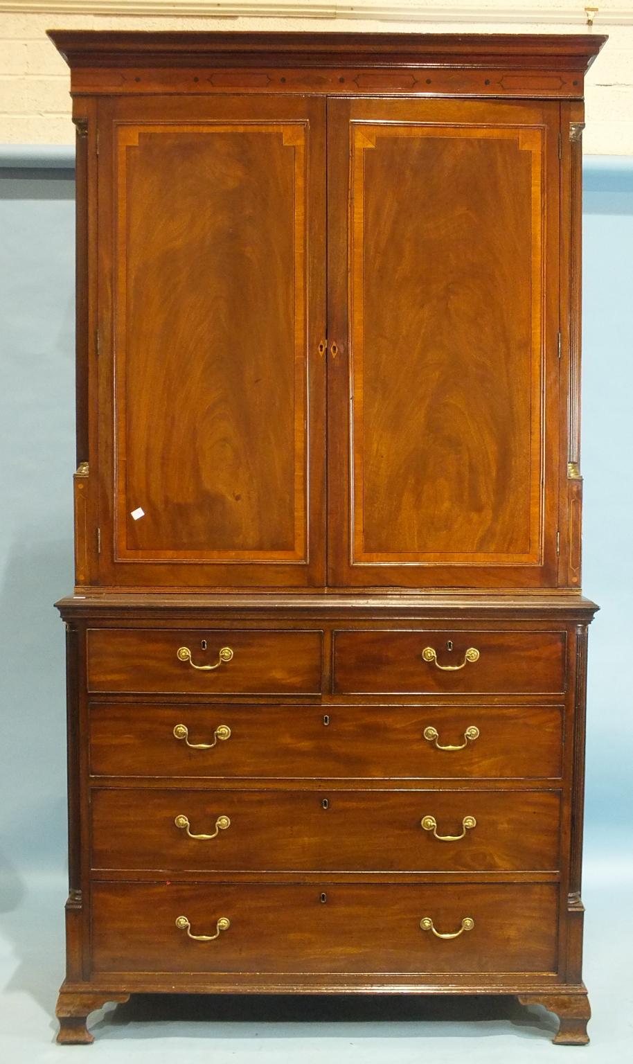 A Georgian mahogany rectangular chest of two short and three long drawers on ogee bracket feet and