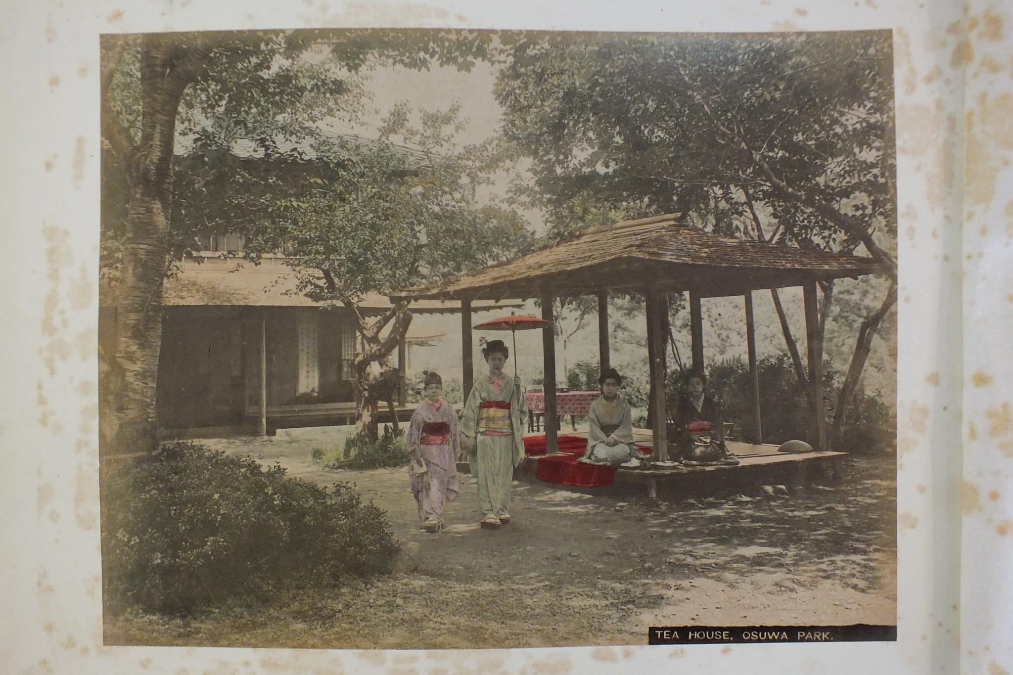 An early-20th century Japanese lacquered shibayama photograph album, containing fifty hand-tinted - Image 47 of 54